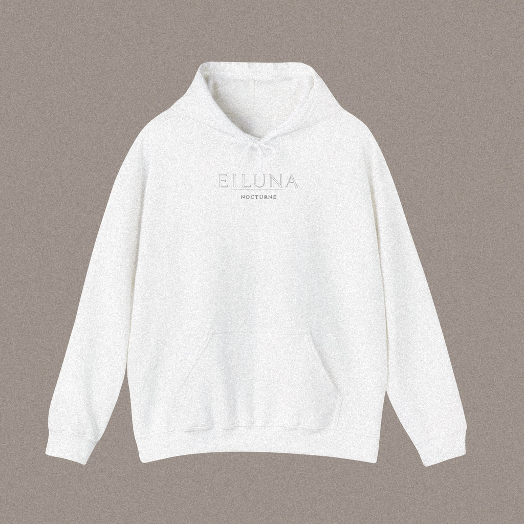 Front of a relaxed-fit white hoodie laid flat, with the EILUNA wordmark and NOCTURNE printed small and centred on the chest.
