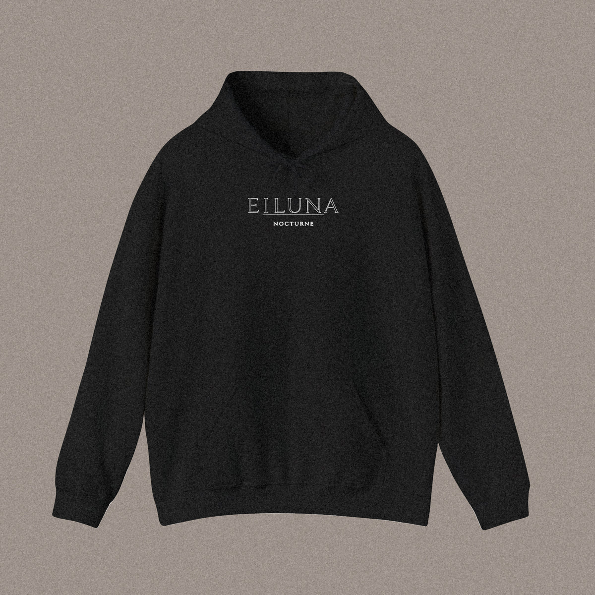 Front of a relaxed-fit black hoodie laid flat, with the EILUNA wordmark and NOCTURNE printed small and centred on the chest.